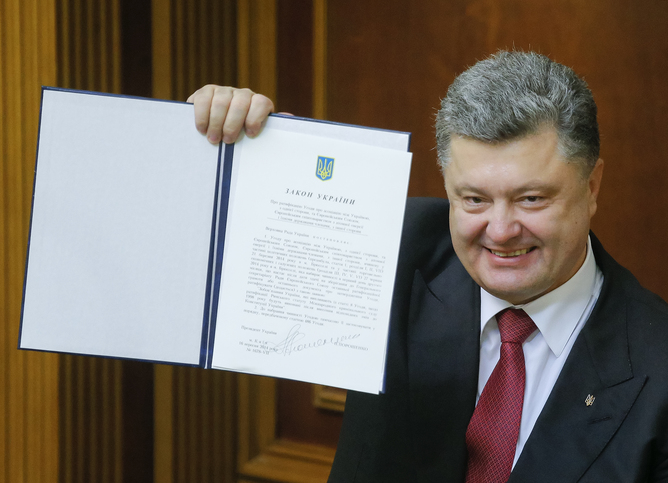 Signed, sealed, delivered: Ukrainian president Poroshenko. EPA/Sergey Dolzhenko