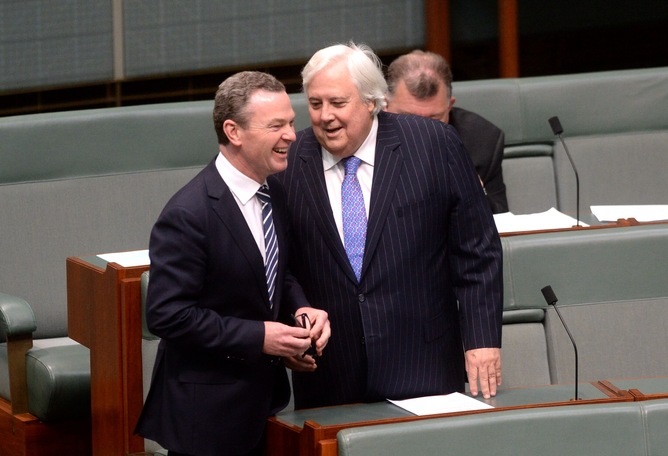 Third time lucky: the carbon tax is set to be repealed, after a deal between Clive Palmer (right) and his Senate PUPs with the government. Alan Porritt/AAP